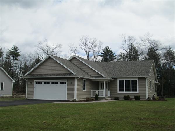 72 Glendale Road Southampton, MA 01073 - Photo 1 of 21 a front view of a house with a garden and trees