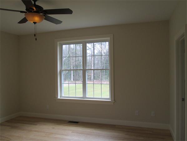 72 Glendale Road Southampton, MA 01073 - Photo 14 of 21 an empty room with a window and a ceiling fan