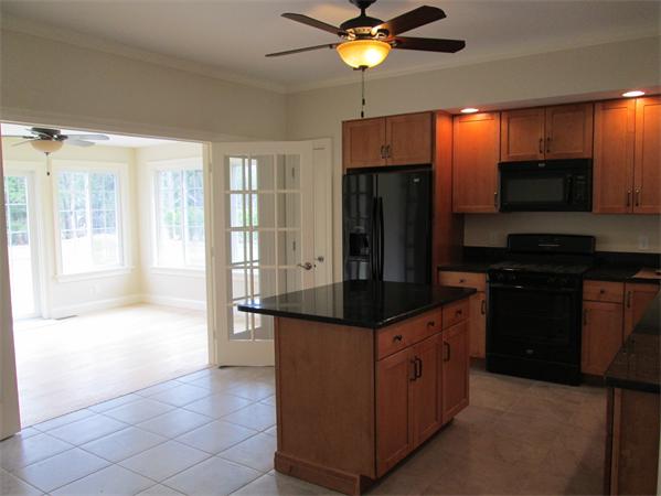 72 Glendale Road Southampton, MA 01073 - Photo 6 of 21 a kitchen with stainless steel appliances a sink and a refrigerator