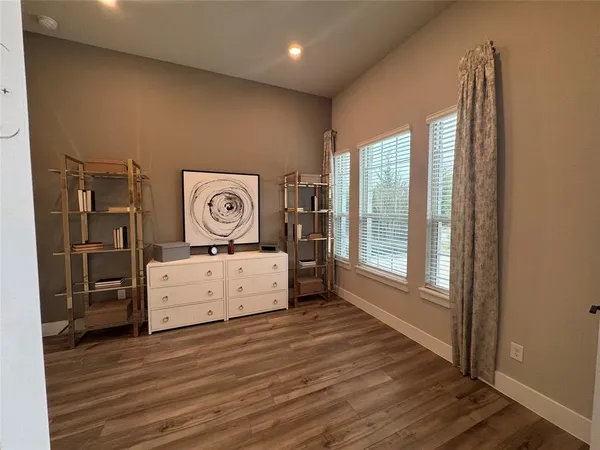 a view of a hardwood floor in a room