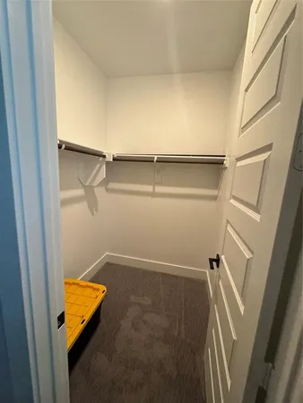 a bathroom with a granite countertop sink mirror vanity and toilet