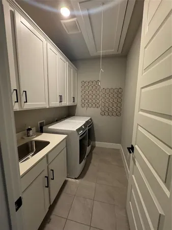 a kitchen with a sink a stove and cabinets