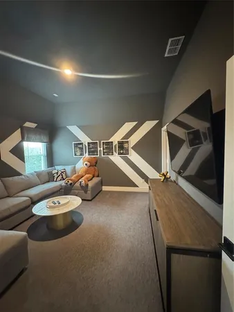 a room with furniture and a ceiling fan