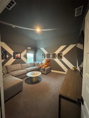 a room with furniture and a potted plant