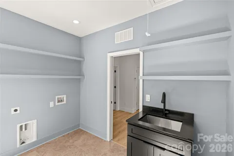 a bathroom with a sink a mirror and a shower