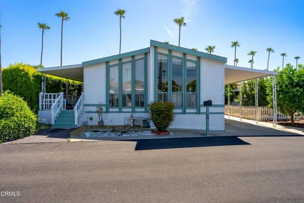 a front view of a building with garden
