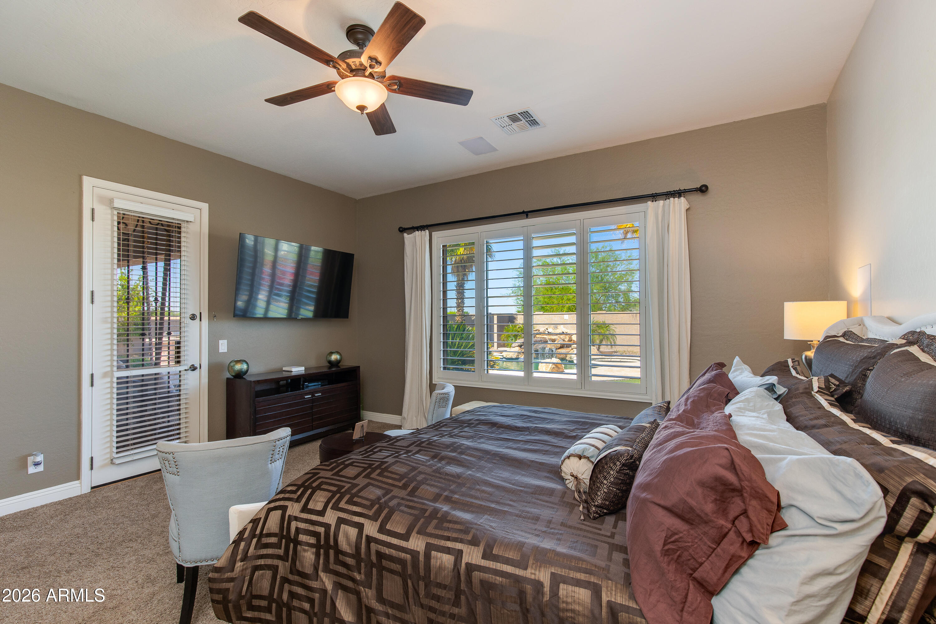 7718 North 84th Lane Glendale, AZ 85305 - Photo 22 of 82 a bed room with a bed and a television