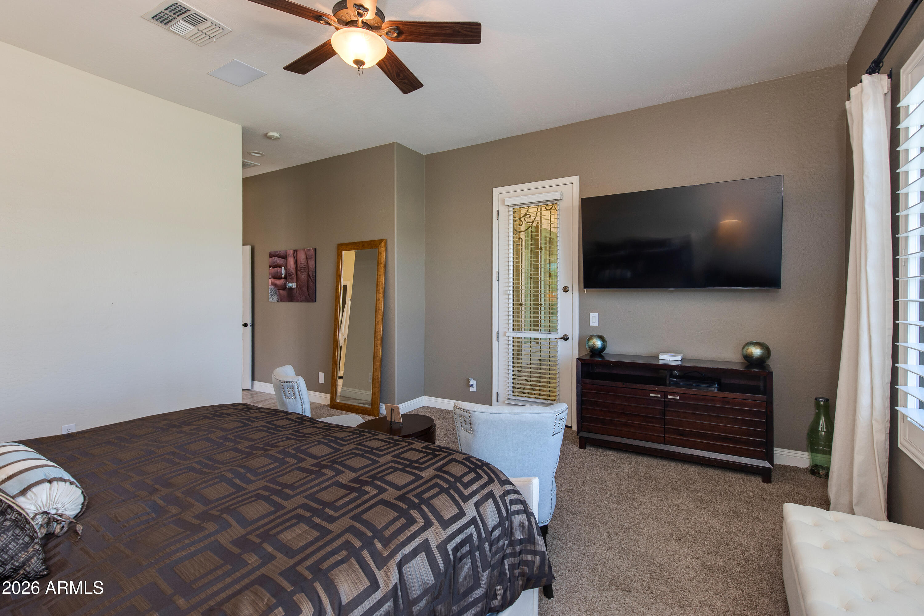 7718 North 84th Lane Glendale, AZ 85305 - Photo 23 of 82 a bedroom with a bed and a flat screen tv