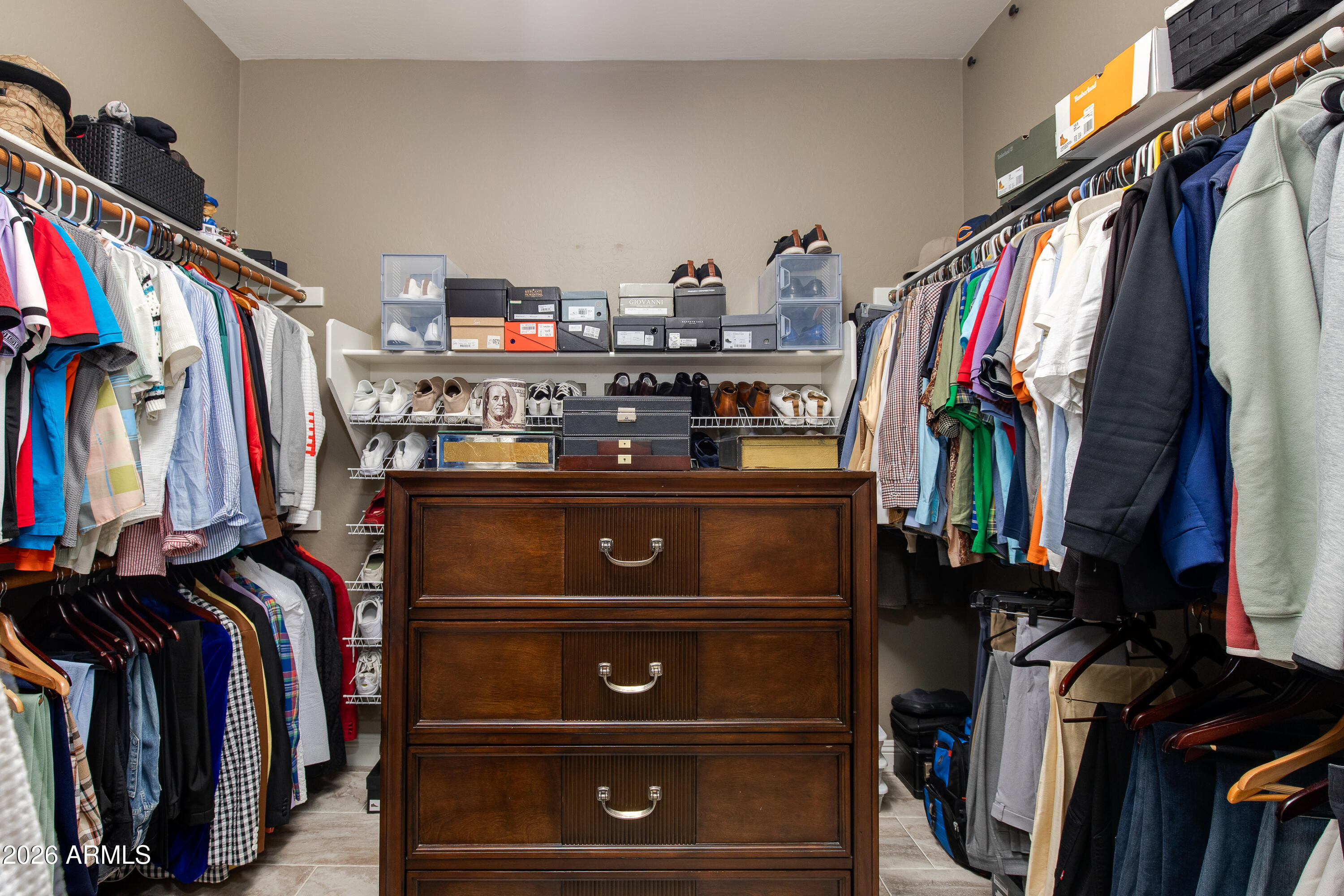 7718 North 84th Lane Glendale, AZ 85305 - Photo 26 of 82 a view of walk in closet with clothes and shoes