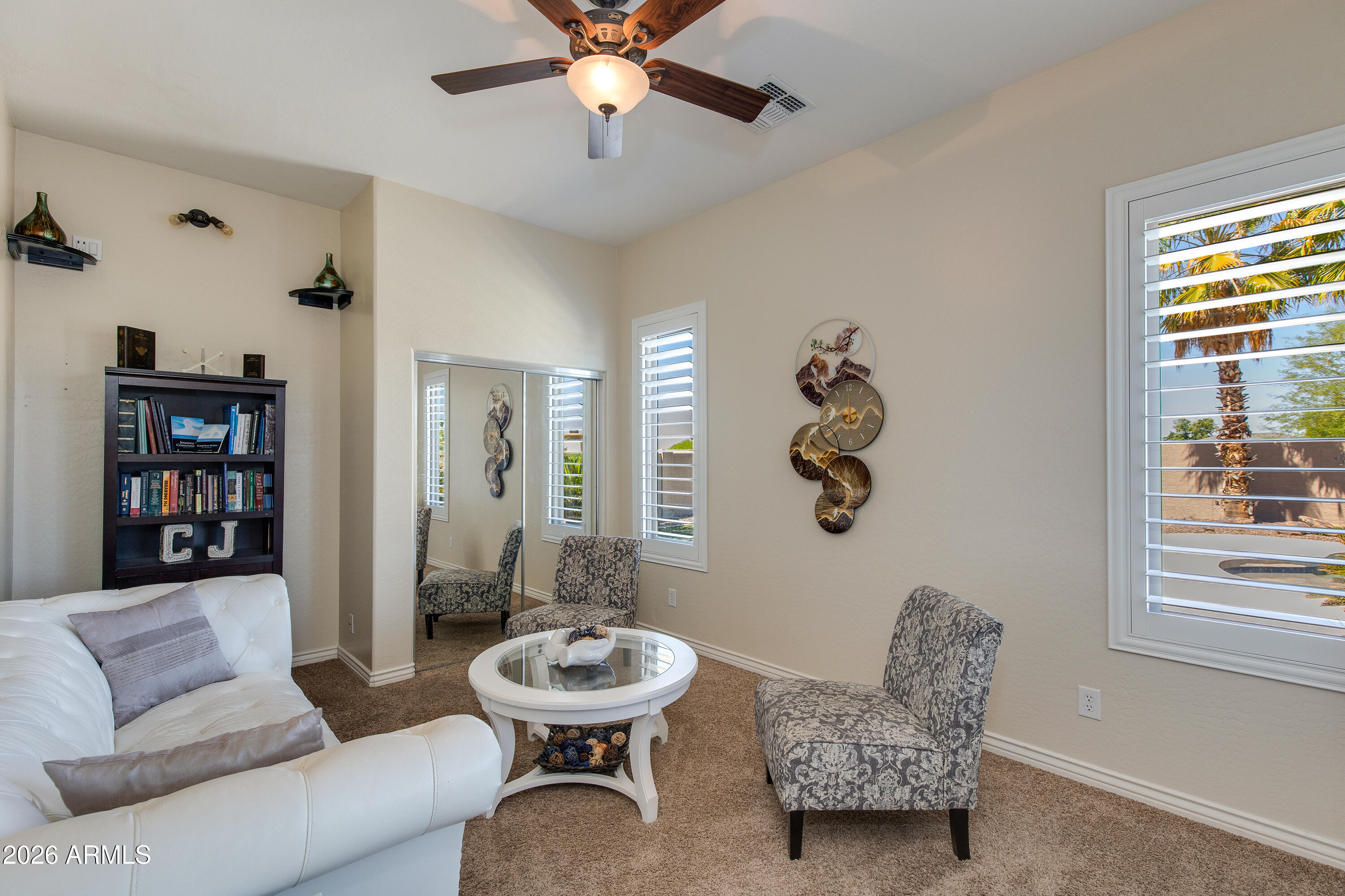 7718 North 84th Lane Glendale, AZ 85305 - Photo 29 of 82 a living room with furniture and a window