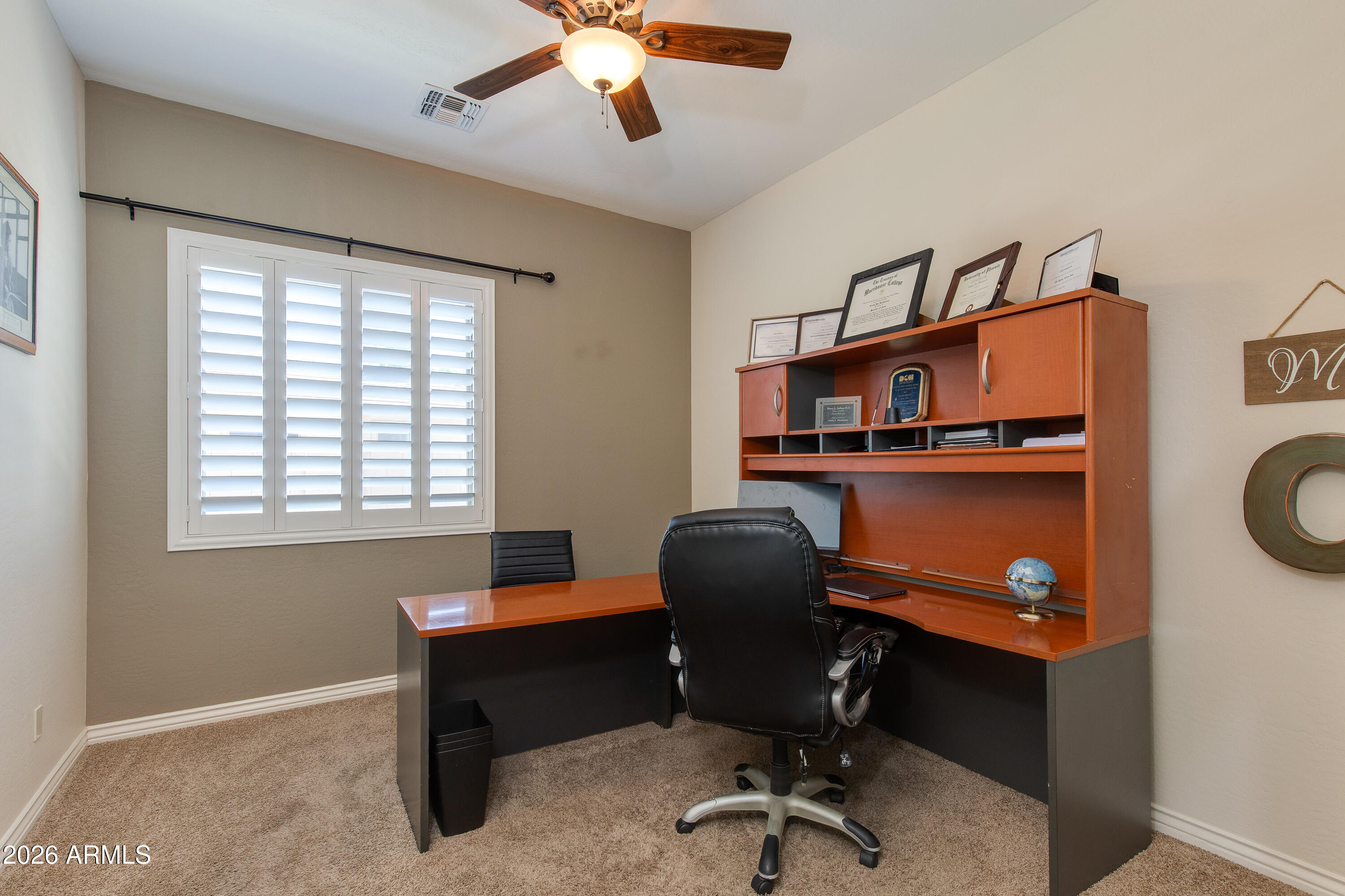 7718 North 84th Lane Glendale, AZ 85305 - Photo 33 of 82 a view of a workspace with furniture and a window