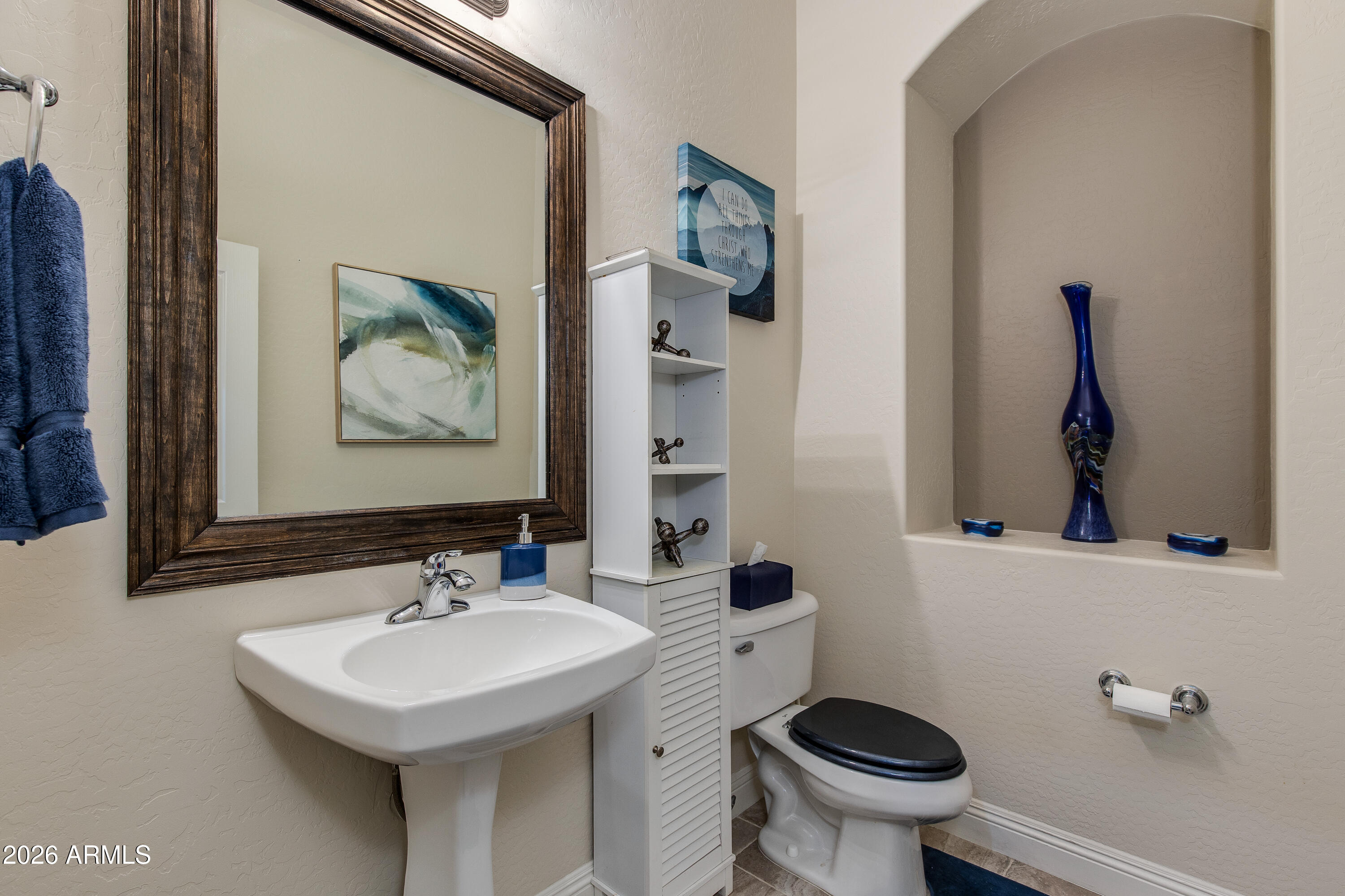 7718 North 84th Lane Glendale, AZ 85305 - Photo 35 of 82 a bathroom with a sink and a mirror
