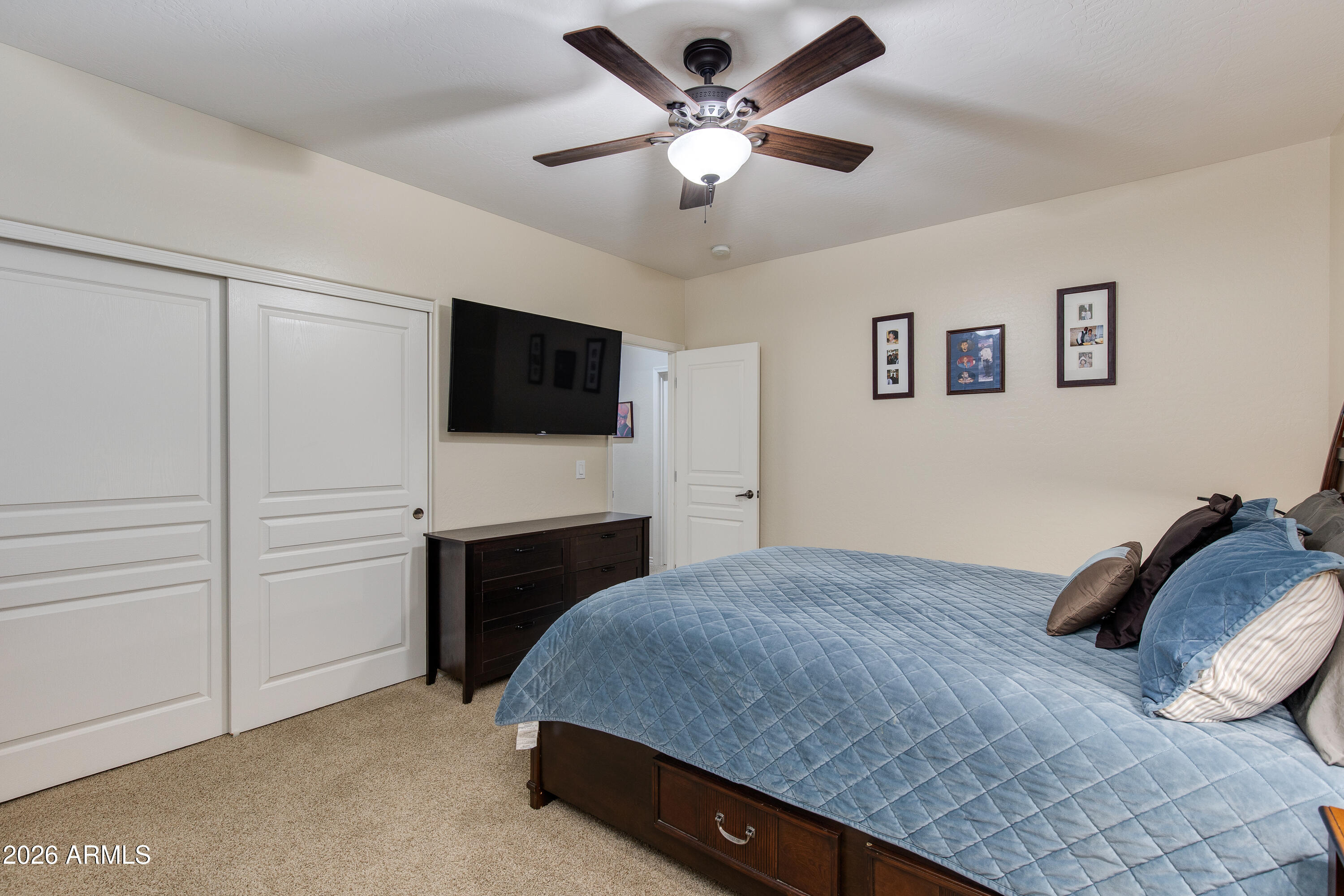 7718 North 84th Lane Glendale, AZ 85305 - Photo 44 of 82 a bedroom with a bed and a flat screen tv