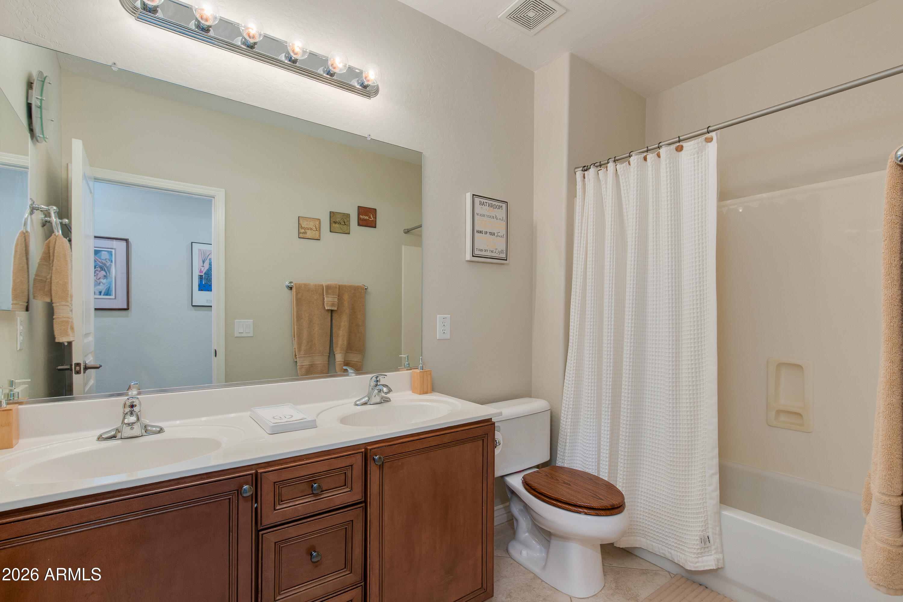 7718 North 84th Lane Glendale, AZ 85305 - Photo 46 of 82 a bathroom with a sink and a toilet