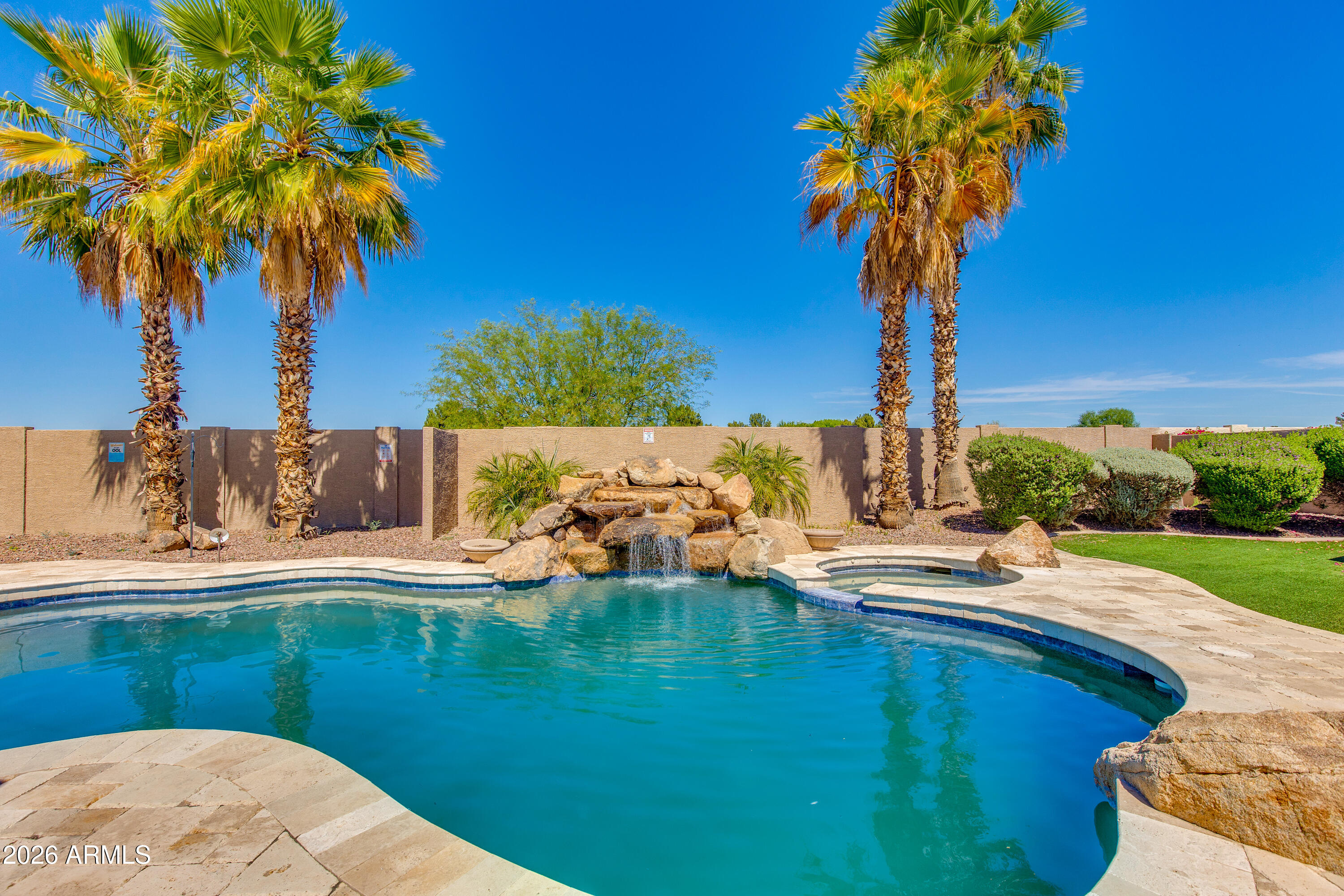 7718 North 84th Lane Glendale, AZ 85305 - Photo 51 of 82 a view of a swimming pool with a yard
