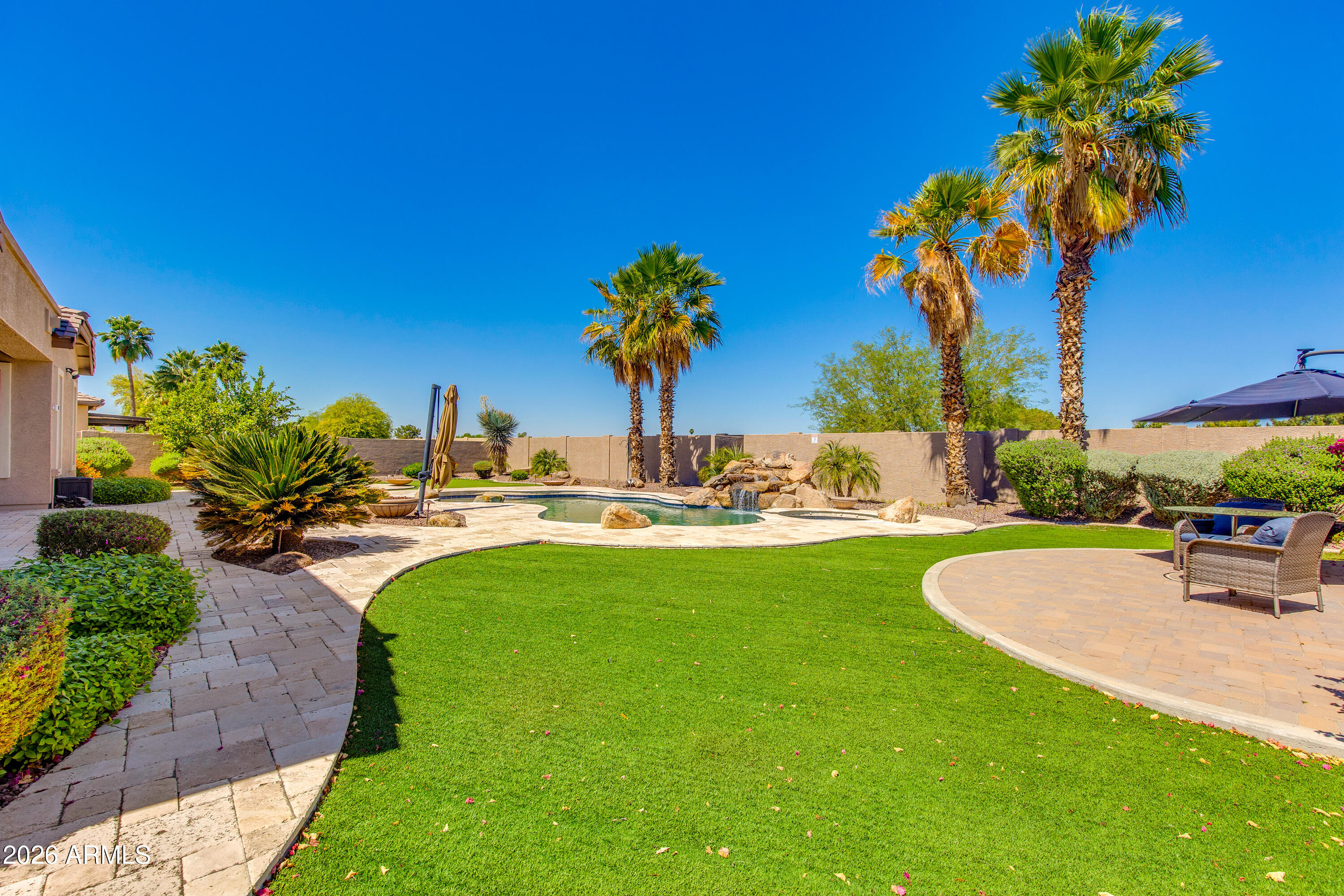 7718 North 84th Lane Glendale, AZ 85305 - Photo 55 of 82 a view of a swimming pool with a table and chairs