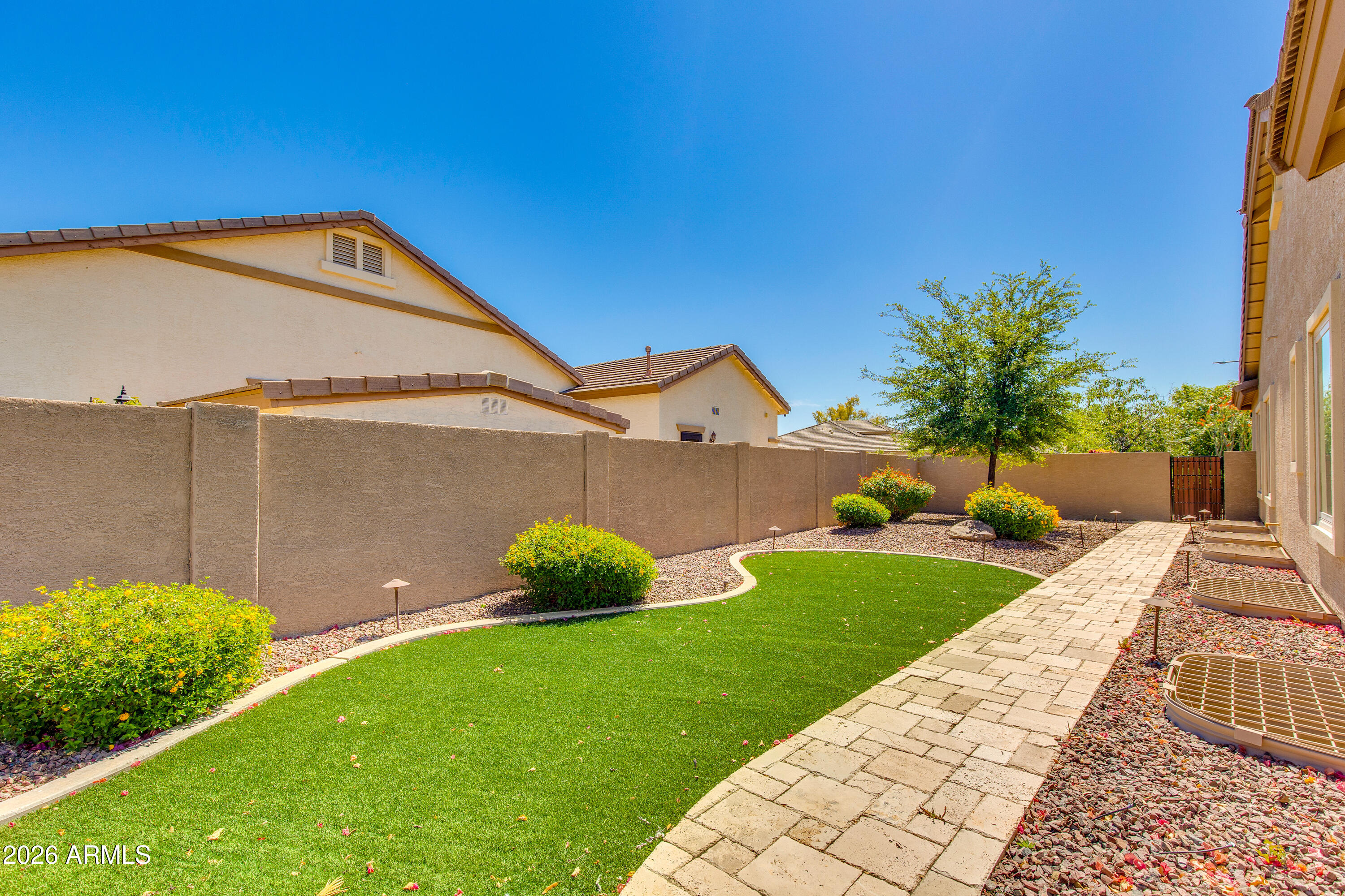 7718 North 84th Lane Glendale, AZ 85305 - Photo 57 of 82 a front view of a house with garden