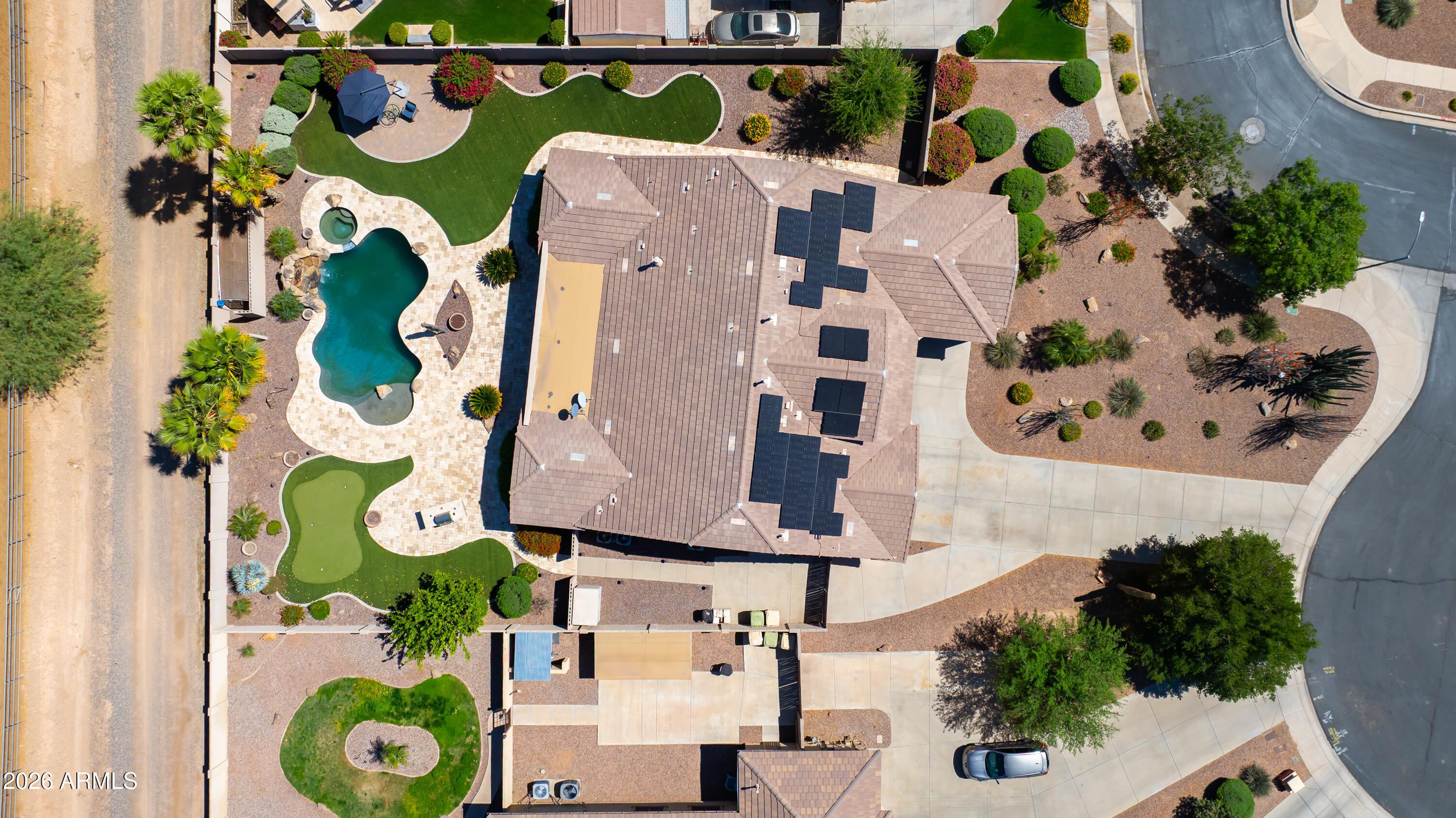7718 North 84th Lane Glendale, AZ 85305 - Photo 65 of 82 an aerial view of residential house with outdoor space and parking