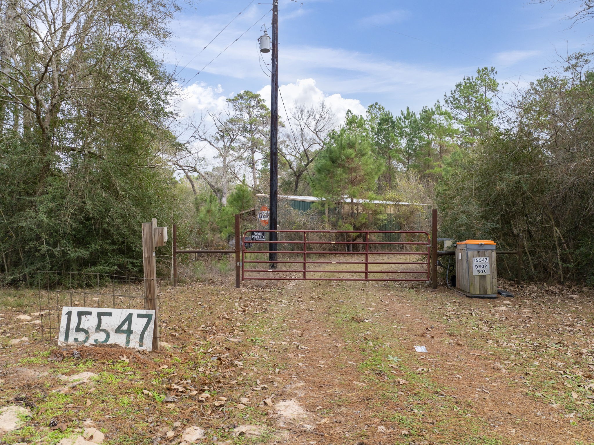 15547 Knotty Oaks Trail Magnolia, TX 77355 - Photo 2 of 11 a view of a park with wooden fence