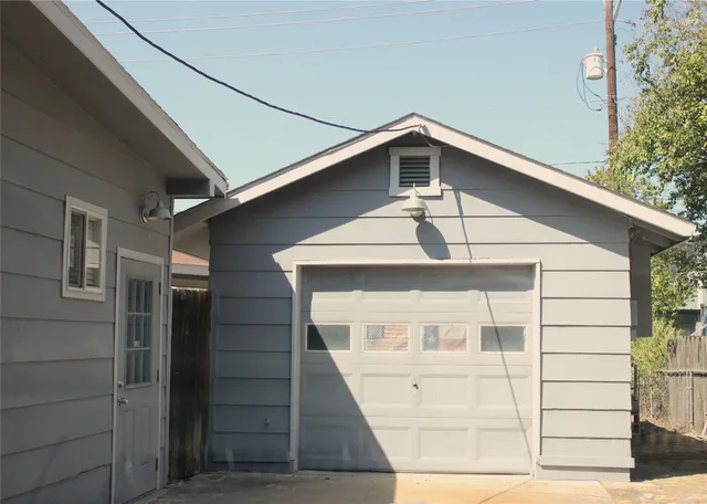 a front view of a house with garage
