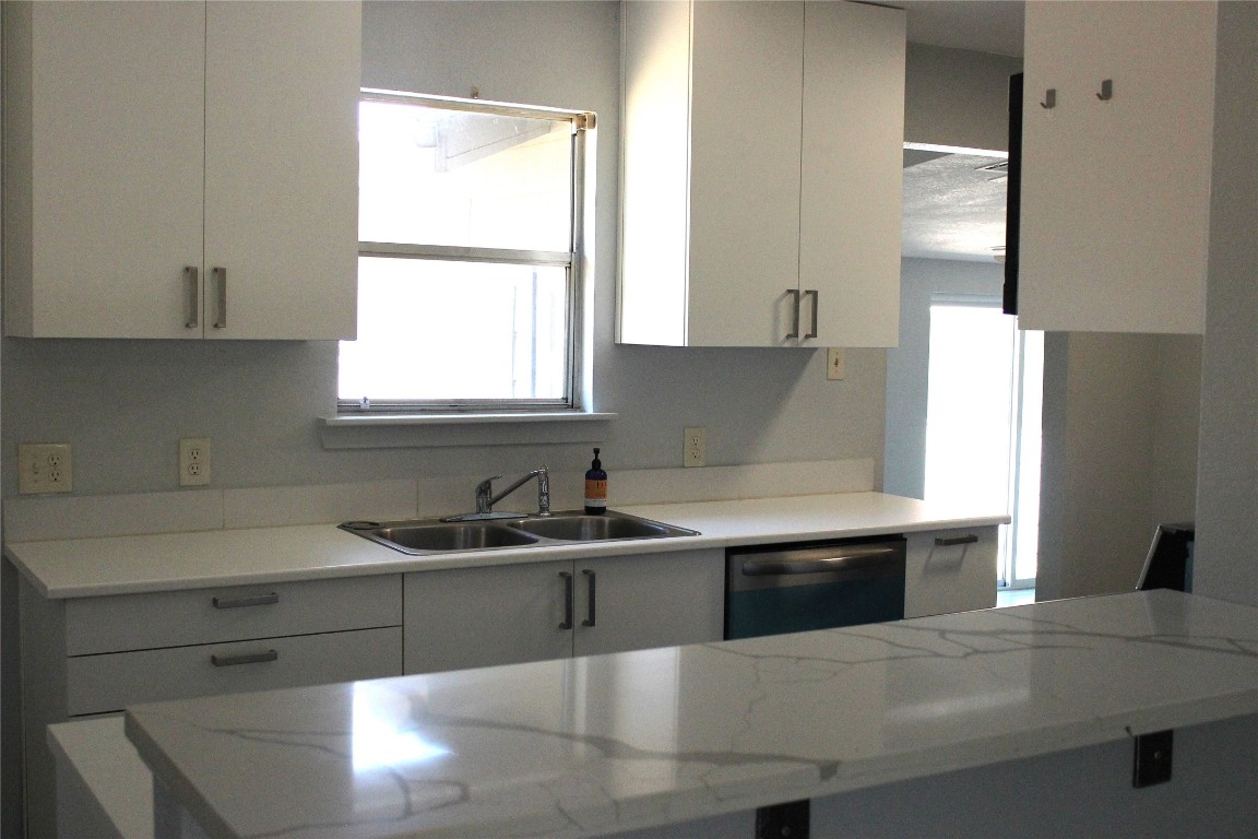 3300 Fritz Hughes Park Road Austin, TX 78732 - Photo 6 of 25 a kitchen with a sink and a window
