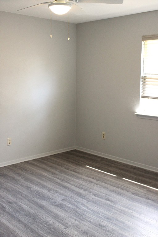 3300 Fritz Hughes Park Road Austin, TX 78732 - Photo 10 of 25 a view of an empty room with wooden floor and a window