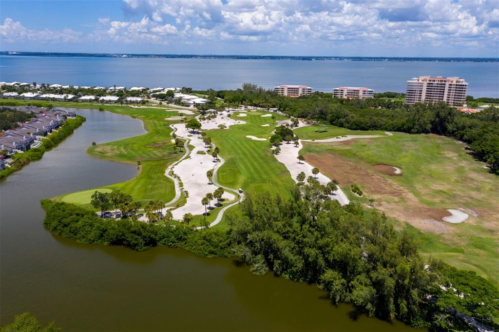 3459 Byron Lane Longboat Key, FL 34228 - Photo 26 of 40 a view of a lake with a building in front of it