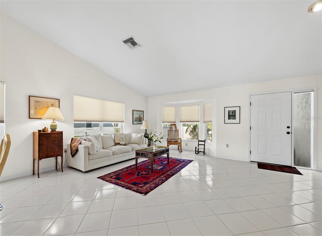 3459 Byron Lane Longboat Key, FL 34228 - Photo 3 of 40 a living room with furniture and a table