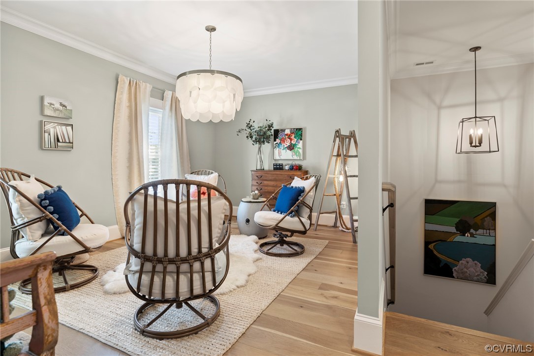 2536 Pagehurst Drive, Unit 7 Midlothian, VA 23113 - Photo 30 of 42 a living room with furniture a fireplace and a chandelier