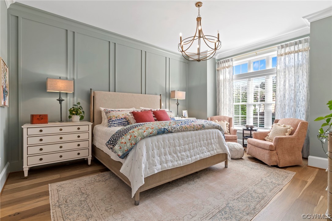 2536 Pagehurst Drive, Unit 7 Midlothian, VA 23113 - Photo 6 of 42 a bedroom with a bed chandelier and window