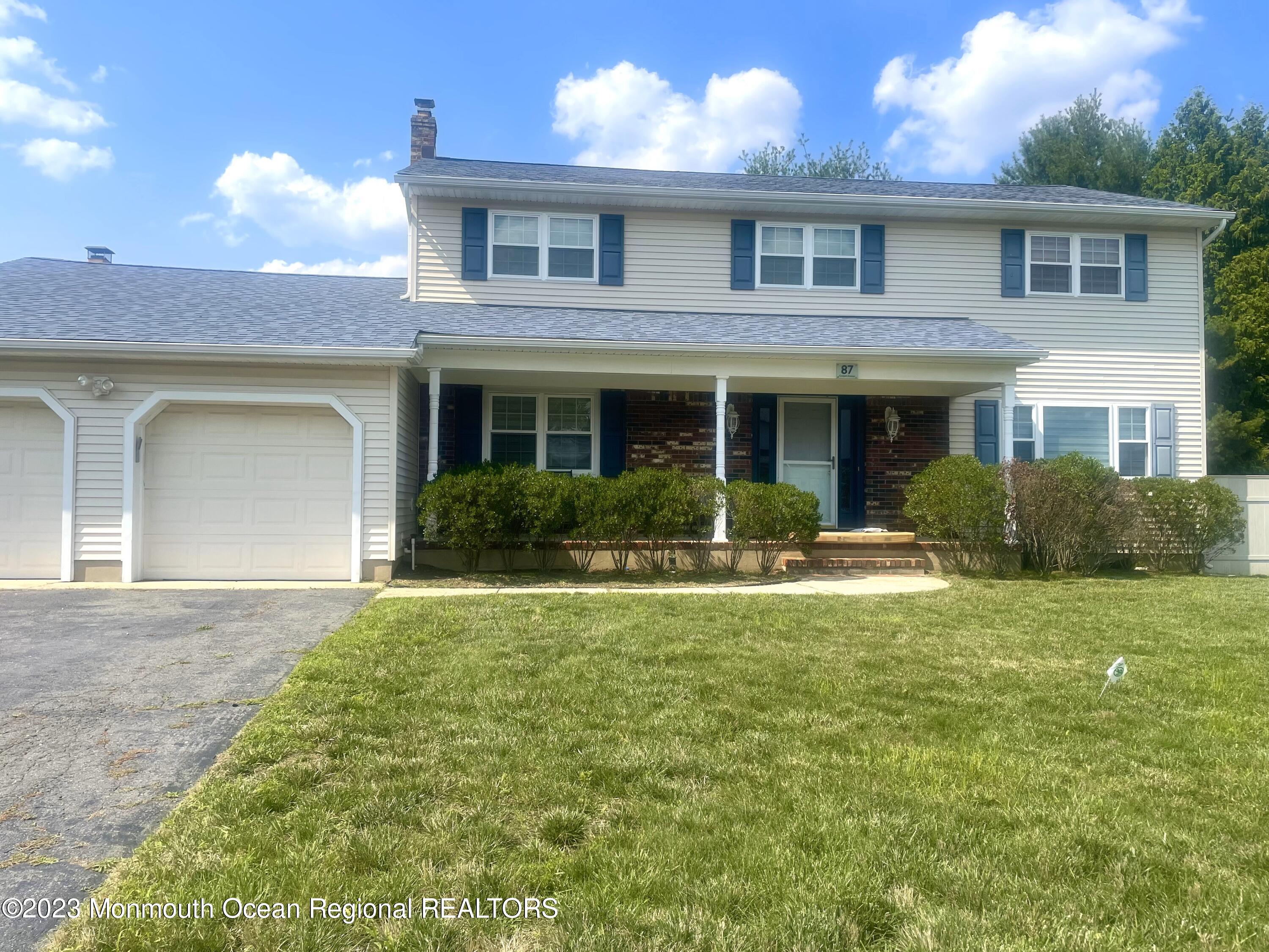 a view of a yard in front of a house