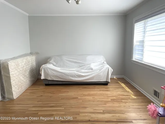 a living room with a bed