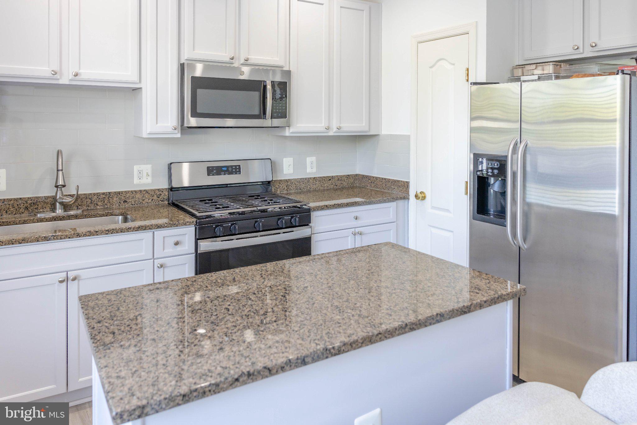 12824 Clarksburg Square Road, Unit 105 Clarksburg, MD 20871 - Photo 39 of 96 Modern kitchen with sleek finishes.