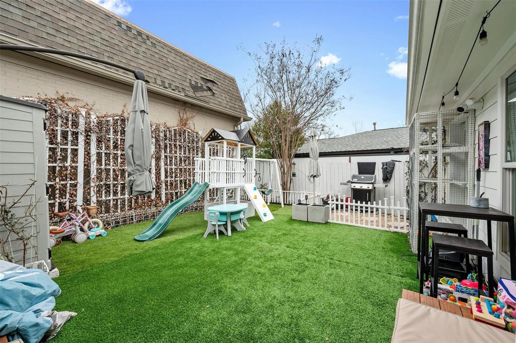 2802 Warren Street, Unit A Austin, TX 78703 - Photo 25 of 29 a view of a house with a yard porch and sitting area