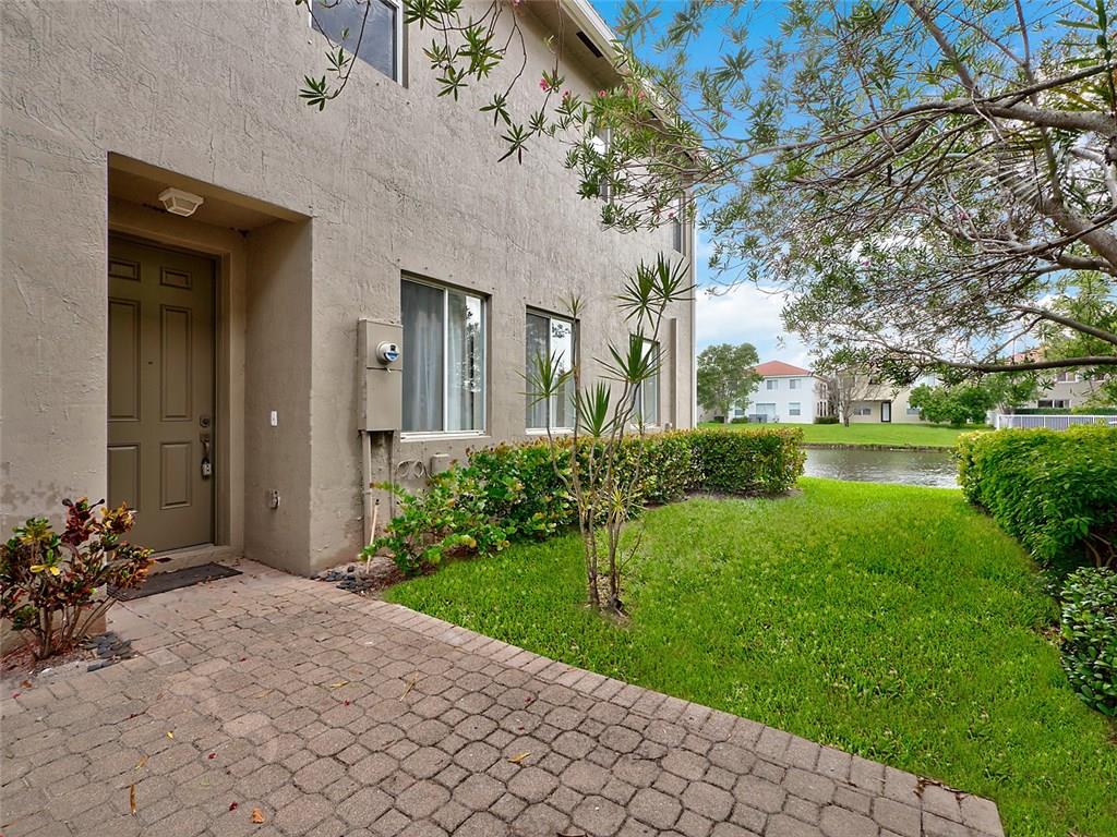 3075 Laurel Ridge Circle Riviera Beach, FL 33404 - Photo 1 of 12 a view of a house with a yard