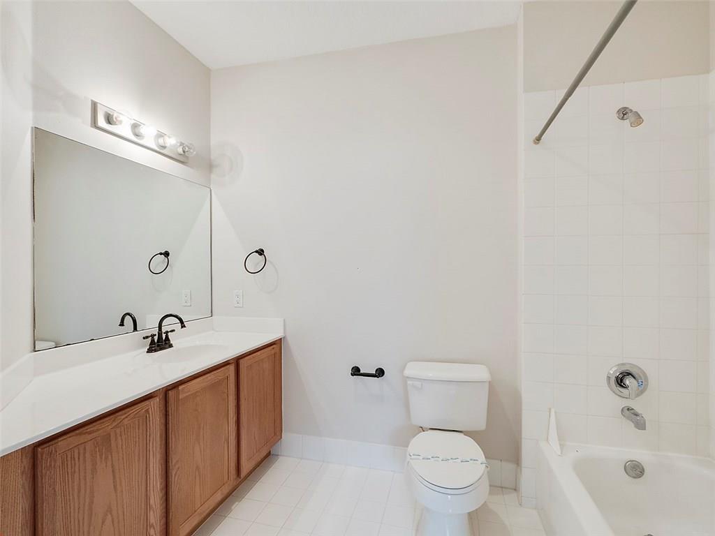 3075 Laurel Ridge Circle Riviera Beach, FL 33404 - Photo 7 of 12 a bathroom with a sink a toilet and shower