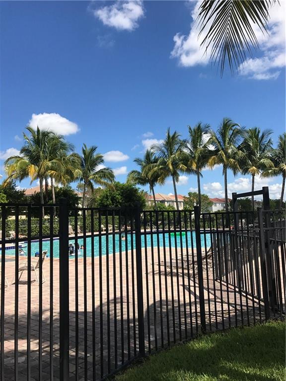 3075 Laurel Ridge Circle Riviera Beach, FL 33404 - Photo 9 of 12 a view of balcony with a palm tree