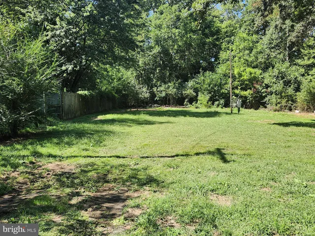 a view of outdoor space with deck and yard