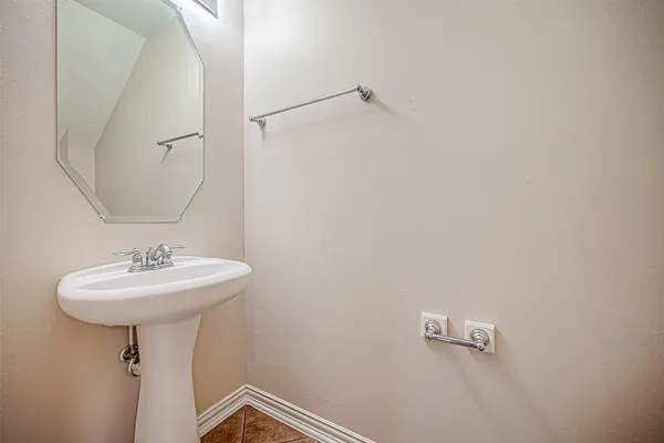 a bathroom with a sink a mirror and shower