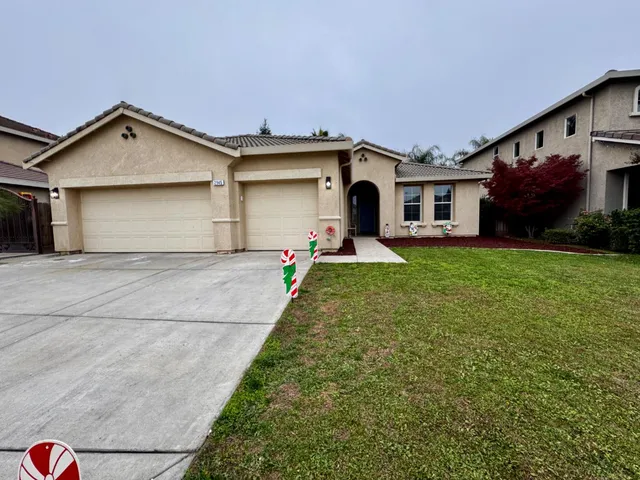 a front view of a house with a yard