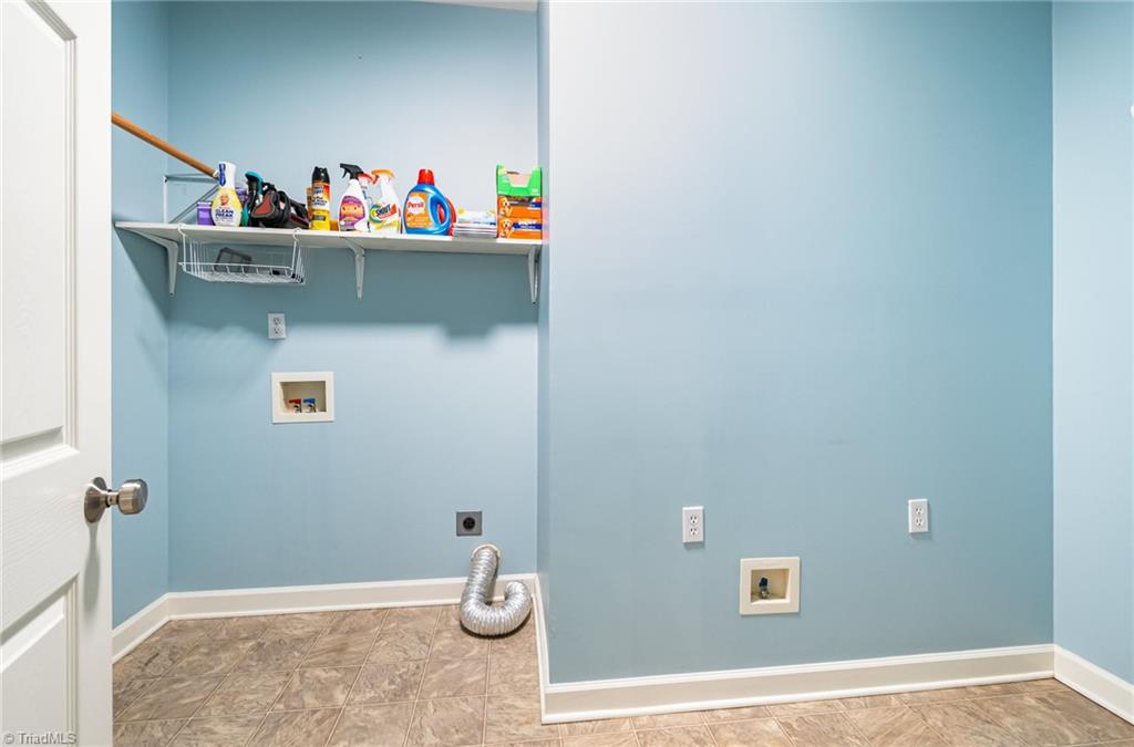339 Old Burkhart Road Lexington, NC 27292 - Photo 28 of 39 Laundry room offers great work space and linen/storage closet