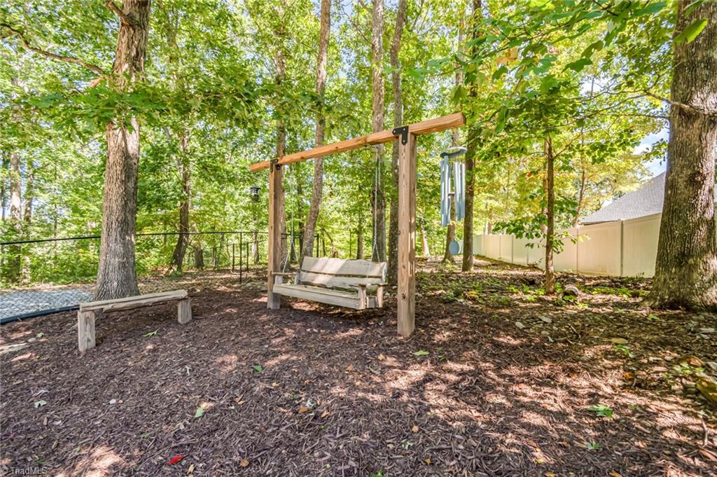 339 Old Burkhart Road Lexington, NC 27292 - Photo 34 of 39 Backyard swing in fenced area does not stay but owners will leave wood beam hanging frame for new swing to be added by a new owner!