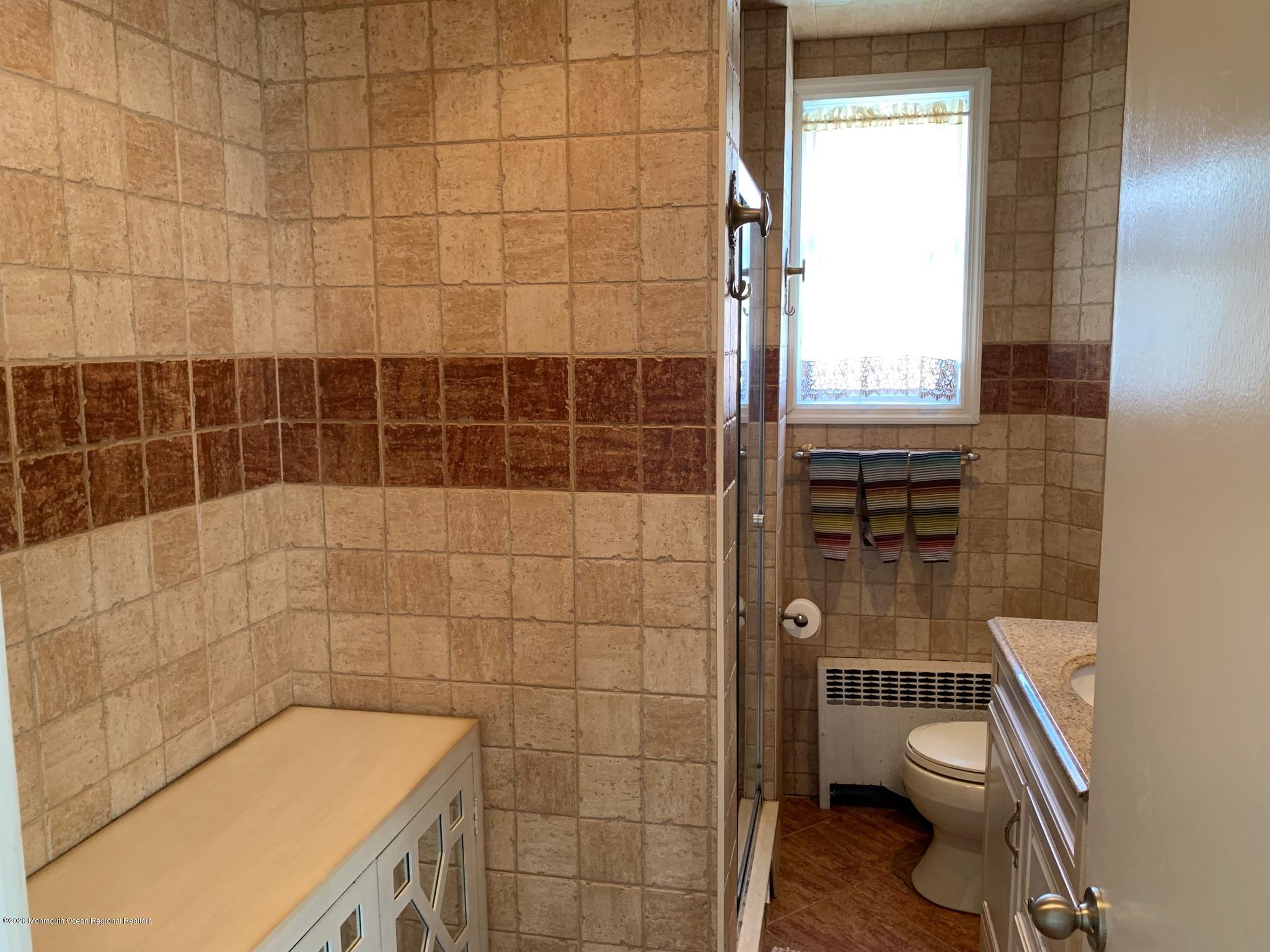 9 Wyckoff Street Deal, NJ 07723 - Photo 8 of 15 a bathroom with a toilet a sink and a shower
