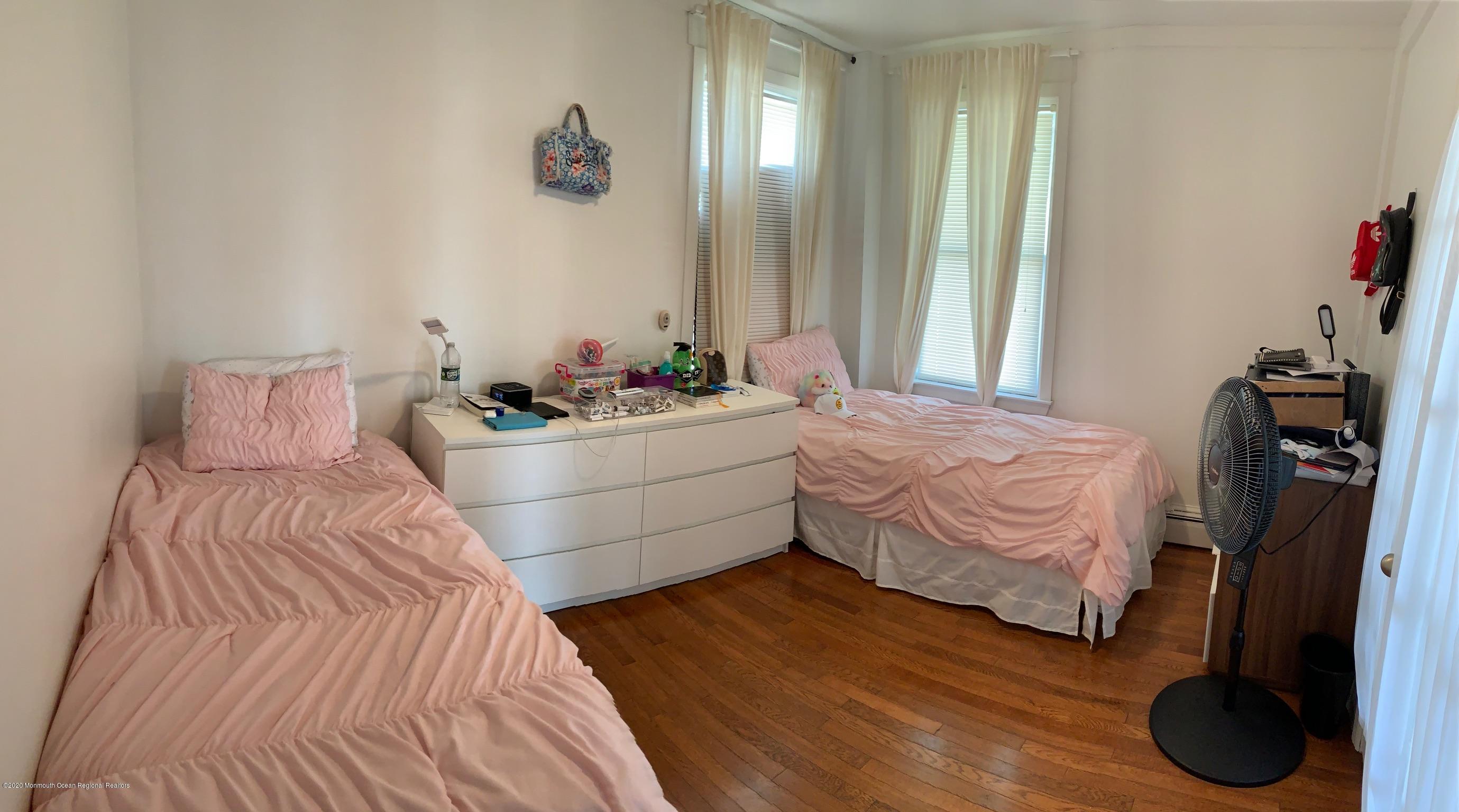 9 Wyckoff Street Deal, NJ 07723 - Photo 9 of 15 a bedroom with a bed and a large mirror