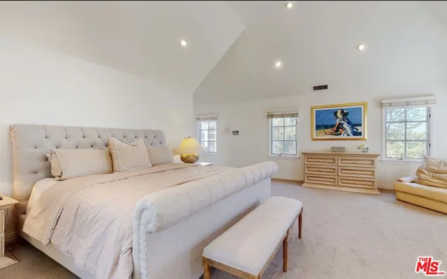 a bedroom with bed and furniture