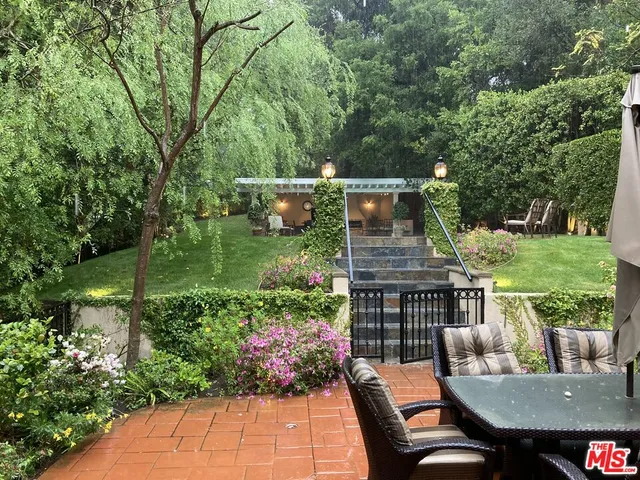 a view of a patio with furniture