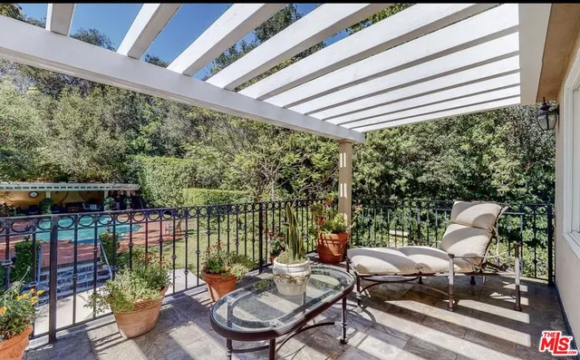 a patio with water view fountain and wooden floor