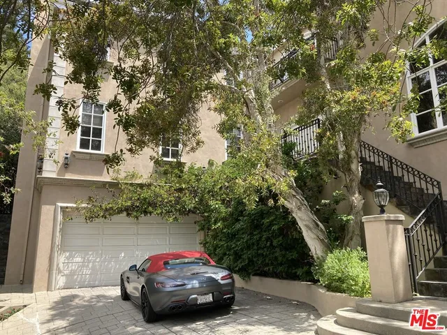 a car parked in front of a house
