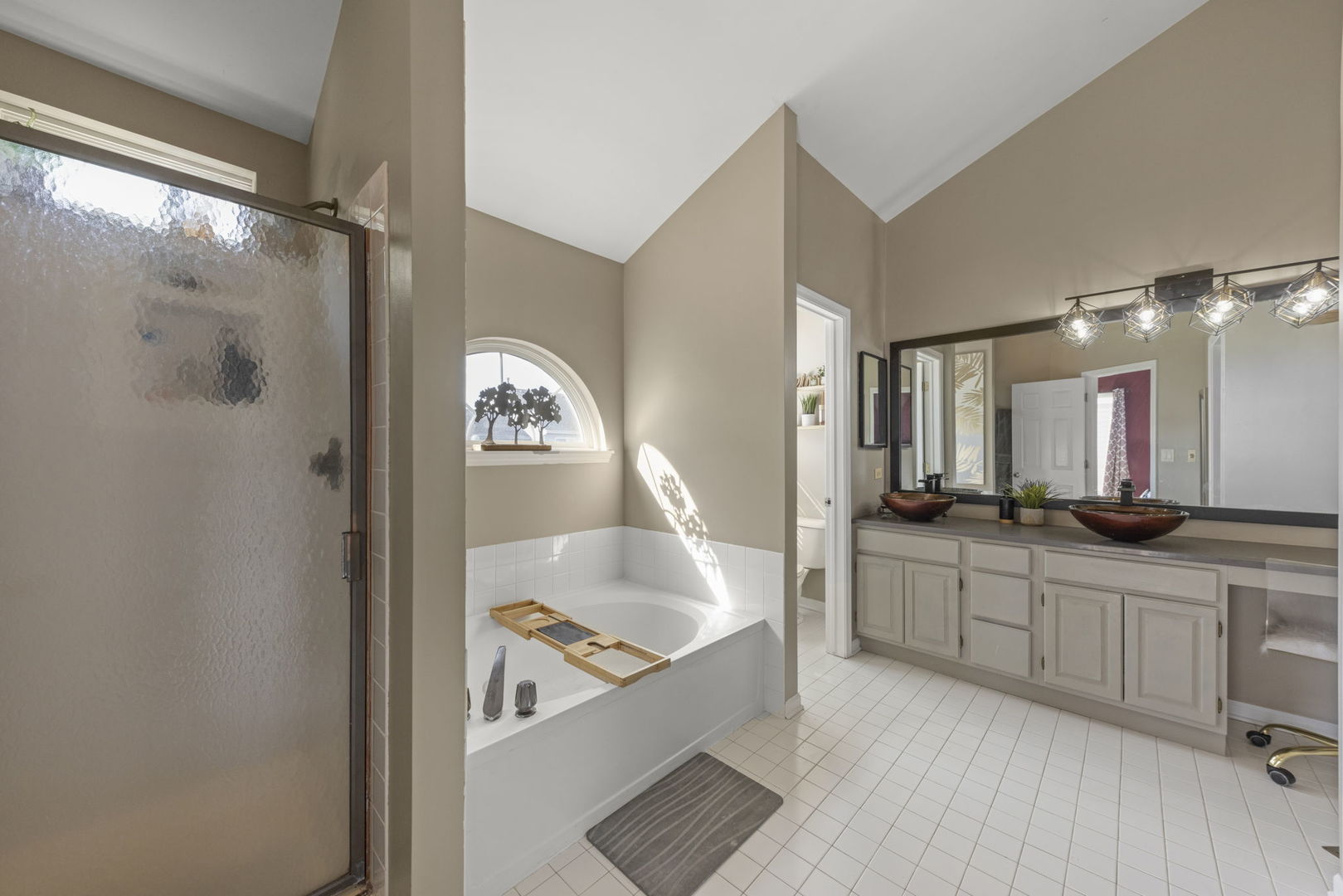 2132 Feldott Lane Naperville, IL 60540 - Photo 19 of 33 a large bathroom with a double vanity sink a mirror and shower