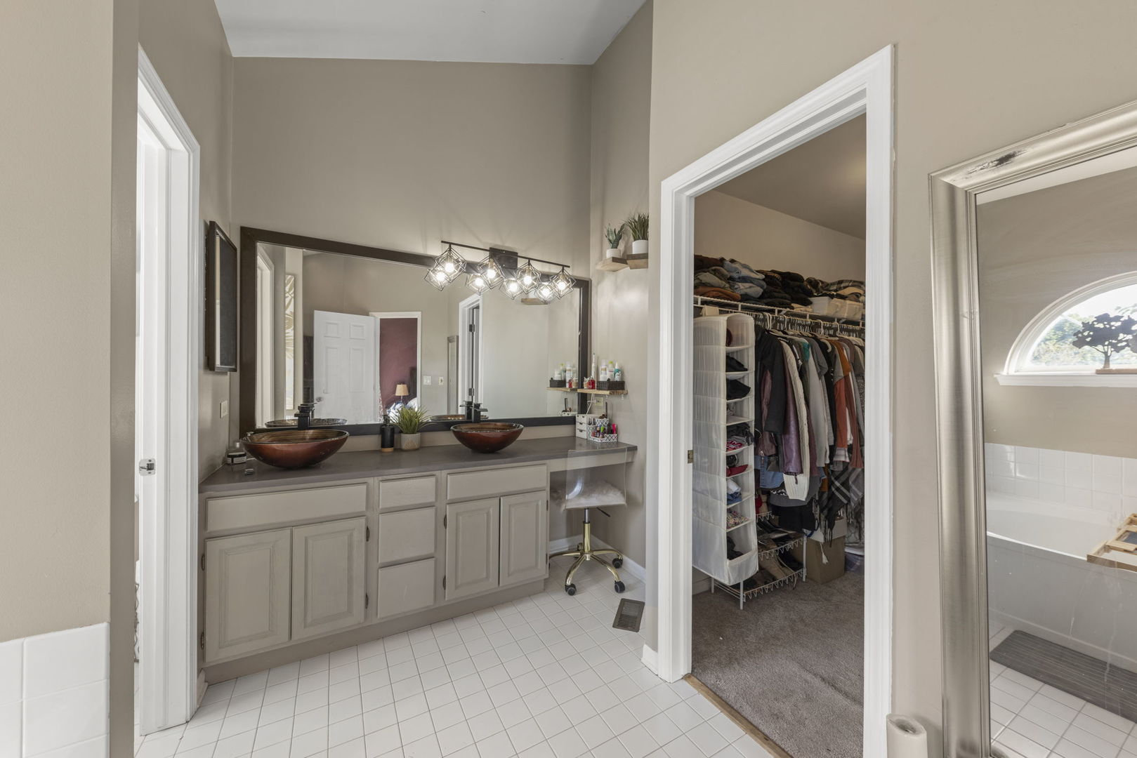 2132 Feldott Lane Naperville, IL 60540 - Photo 20 of 33 a en suite bathroom with a double vanity sink and a mirror